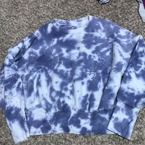 A purple/blue tie dye sweater